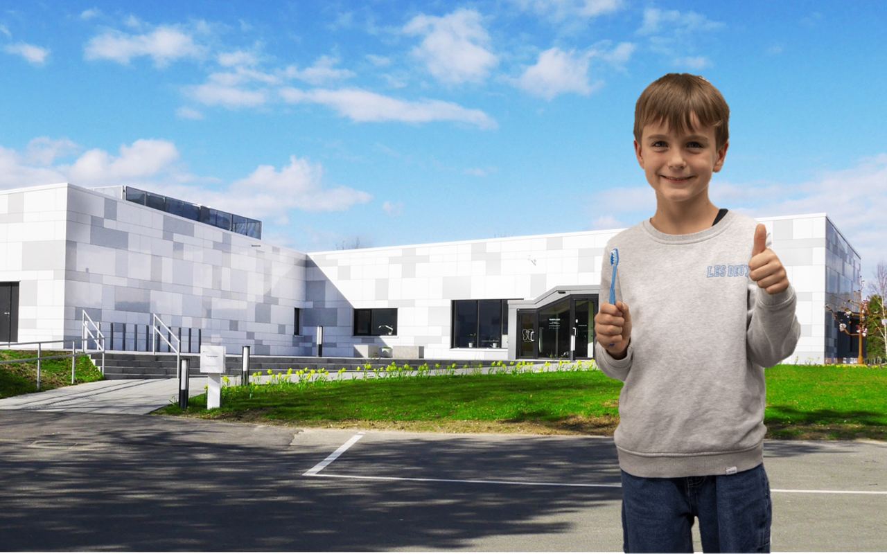 Nordfyns Kommunes tandpleje, hvid bygning med smilende dreng